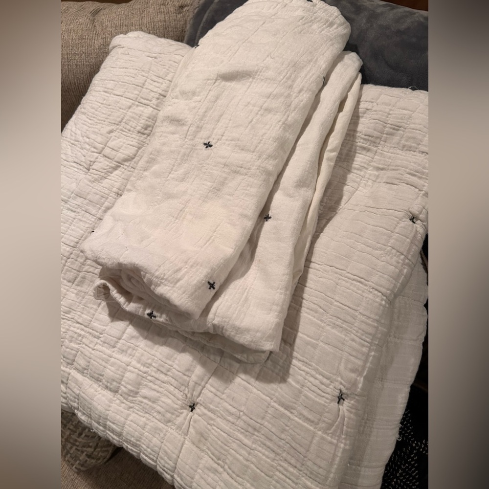White Bedding With Matching Blue Throw Pillows